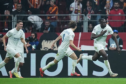 Union SG's Promise David, right, celebrates scoring the opening goal during the Champions League opening phase soccer match between Galatasaray and Union Saint-Gilloise, in Istanbul, Turkey.