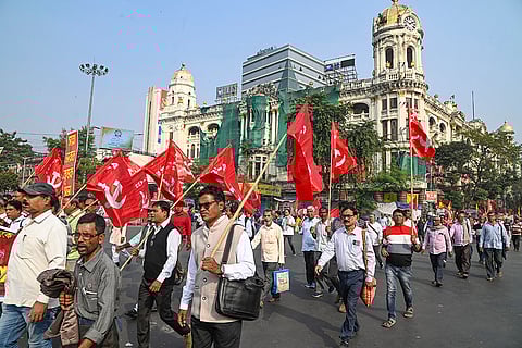Members of various Left organizations take part in a rally over the new labour codes, in Kolkata.