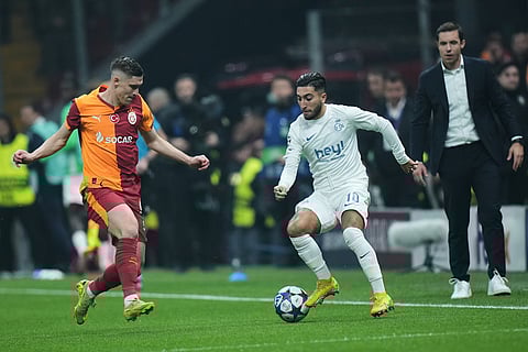Galatasaray's Roland Sallai, left, fights for the ball with Union SG's Anouar Ait El Hadj during the Champions League opening phase soccer match between Galatasaray and Union Saint-Gilloise, in Istanbul, Turkey.
