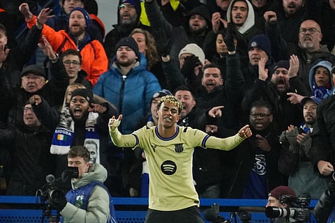 Barcelona's Lamine Yamal gestures during the Champions League opening phase soccer match between Chelsea and Barcelona in London.