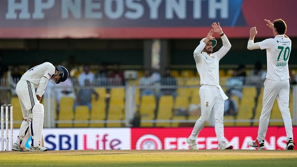 South Africa's Marco Jansen, right, celebrates with teammates after the dismissal of India's Yashasvi Jaiswal, left, on the fourth day of the second cricket test match between India and South Africa in Guwahati. - | Photo: AP/Anupam Nath