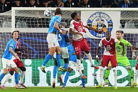 Pafos' David Luiz heads the ball ahead of Monaco's Michal, centre, during the Champions League opening phase soccer match between Pafos FC and AS Monaco in Limassol, Cyprus.