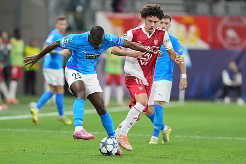 Pafos' Bruno Langa, left, challenges for the ball with Monaco's Maghnes Akliouche during the Champions League opening phase soccer match between Pafos FC and AS Monaco in Limassol, Cyprus.