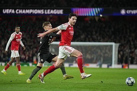Arsenal's Declan Rice, right, is challenged by Bayern's Lennart Karl during the Champions League opening phase soccer match between Arsenal and Bayern Munich in London.