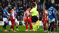 | Photo: AP/Andrew Milligan : Referee Allard Lindhout shows Sporting Braga's Rodrigo Zalazar a red card during the UEFA Europa League opening league phase match against Rangers on November 27, 2025. 