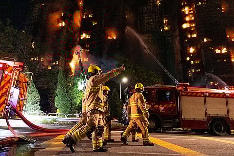 Firefighters work to extinguish a fire that broke out at Wang Fuk Court, a residential estate in the Tai Po district of Hong Kong's New Territories.