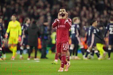 Liverpool's Mohamed Salah applauds after the Champions League opening phase soccer match between Liverpool and PSV in Liverpool, England.