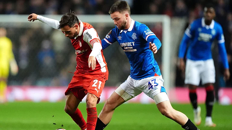 Sporting Braga's Ricardo Horta and Rangers' Nicolas Raskin in action during the UEFA Europa League opening league phase match on November 27, 2025. - | Photo: AP/Andrew Milligan