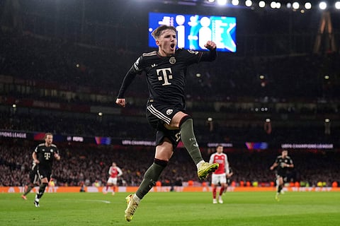 Bayern's Lennart Karl celebrates after scoring his side's first goal during the Champions League opening phase soccer match between Arsenal and Bayern Munich in London, England.