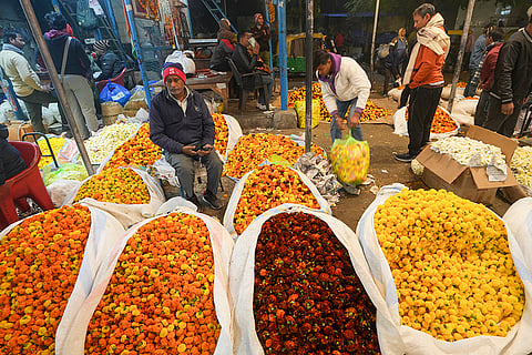 Vendors sell flowers at Ghazipur flower market, in New Delhi.