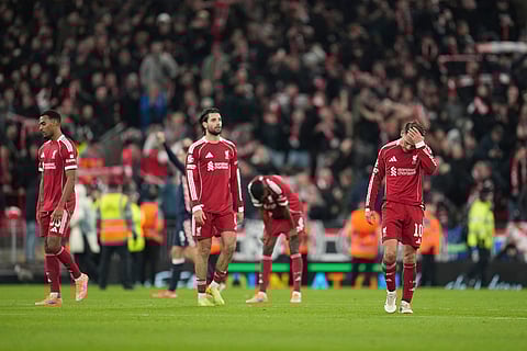 Liverpool's Alexis Mac Allister, right, reacts after the Champions League opening phase soccer match between Liverpool and PSV in Liverpool, England.