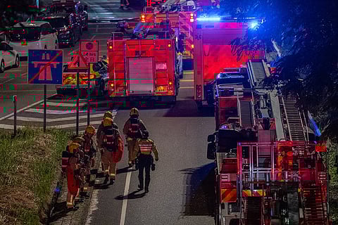 Firefighters work to extinguish a fire which broke out at Wang Fuk Court, a residential estate in the Tai Po district of Hong Kong's New Territories.