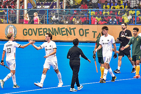 Germany and South African players exchange greetings after the former won the inaugural match of the Hockey Men's Junior World Cup 2025, in Madurai, Tamil Nadu.