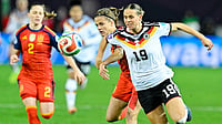 | Photo: dpa/Uwe Anspach via AP : Germany's Klara Buhl and Spain's Irene Paredes fight for the ball during the UEFA Women's Nations League match on November 28, 2025. 