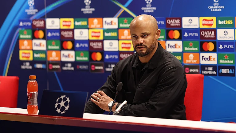 Bayern Munich manager Vincent Kompany attends a press conference after the UEFA Champions League match against Arsenal on November 27, 2025. - null