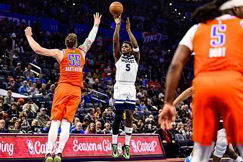 Minnesota Timberwolves guard Anthony Edwards (5) shoots against Oklahoma City Thunder center/forward Isaiah Hartenstein (55) during the second half of an Emirates NBA Cup basketball game in Oklahoma City. 