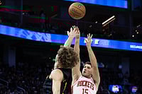| Photo: AP/Benjamin Fanjoy : Houston Rockets guard Reed Sheppard shoots past Golden State Warriors guard Brandin Podziemski during the second half of an Emirates NBA Cup basketball game in San Francisco. 