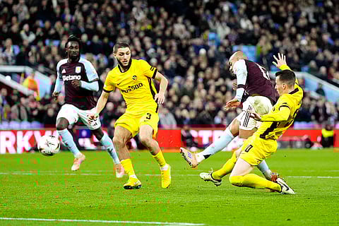Aston Villa's Donyell Malen, second right, scores his side's second goal during the Europa League soccer match between Aston Villa and Young Boys in Birmingham, England.