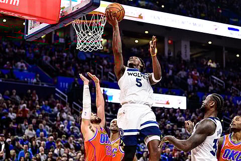 Minnesota Timberwolves guard Anthony Edwards (5) shoots against Oklahoma City Thunder guard Ajay Mitchell (25) during the second half of an Emirates NBA Cup basketball game in Oklahoma City. 