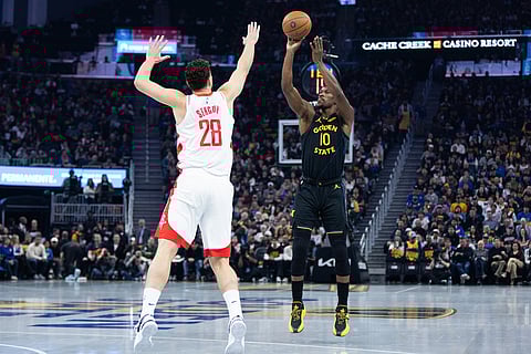 Golden State Warriors forward Jimmy Butler III shoots past Houston Rockets center Alperen Şengün during the first half of an Emirates NBA Cup basketball game in San Francisco.