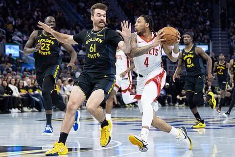 Golden State Warriors guard Pat Spencer (61) defends against Houston Rockets guard JD Davison during the second half of an Emirates NBA Cup basketball game in San Francisco. 