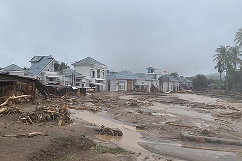 This photo released by Indonesia's National Disaster Management Agency (BNPB) shows houses affected by floods in Padang, West Sumatra, Indonesia. 