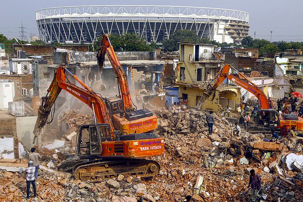 Authorities demolish structures near Narendra Modi Stadium