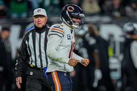 Chicago Bears quarterback Caleb Williams (18) celebrates running back Kyle Monangai's (25) touchdown during the second half of an NFL football game against the Philadelphia Eagles in Philadelphia.