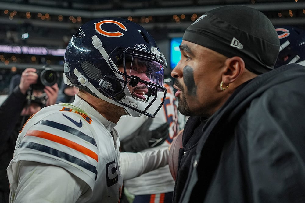 Chicago Bears quarterback Caleb Williams (18), left, hugs Philadelphia Eagles quarterback Jalen Hurts (1) after the Bear's win in an NFL football game in Philadelphia.  - | Photo: AP/Matt Slocum