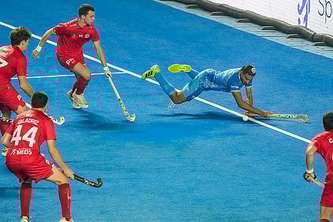 Players of India (in blue) and Chile vie for the ball during the FIH Hockey Men's Junior World Cup 2025 match, at Mayor Radhakrishnan Hockey Stadium, in Chennai, Tamil Nadu.