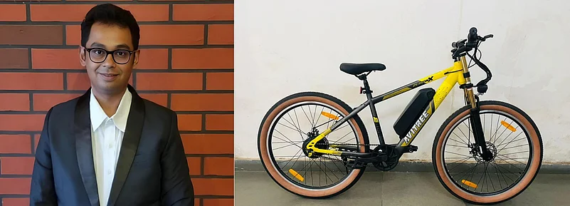 Man in suit next to Avitree electric bike