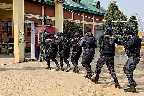 Security personnel conduct a mock drill at Bijbehara railway station, in Anantnag, Jammu and Kashmir.