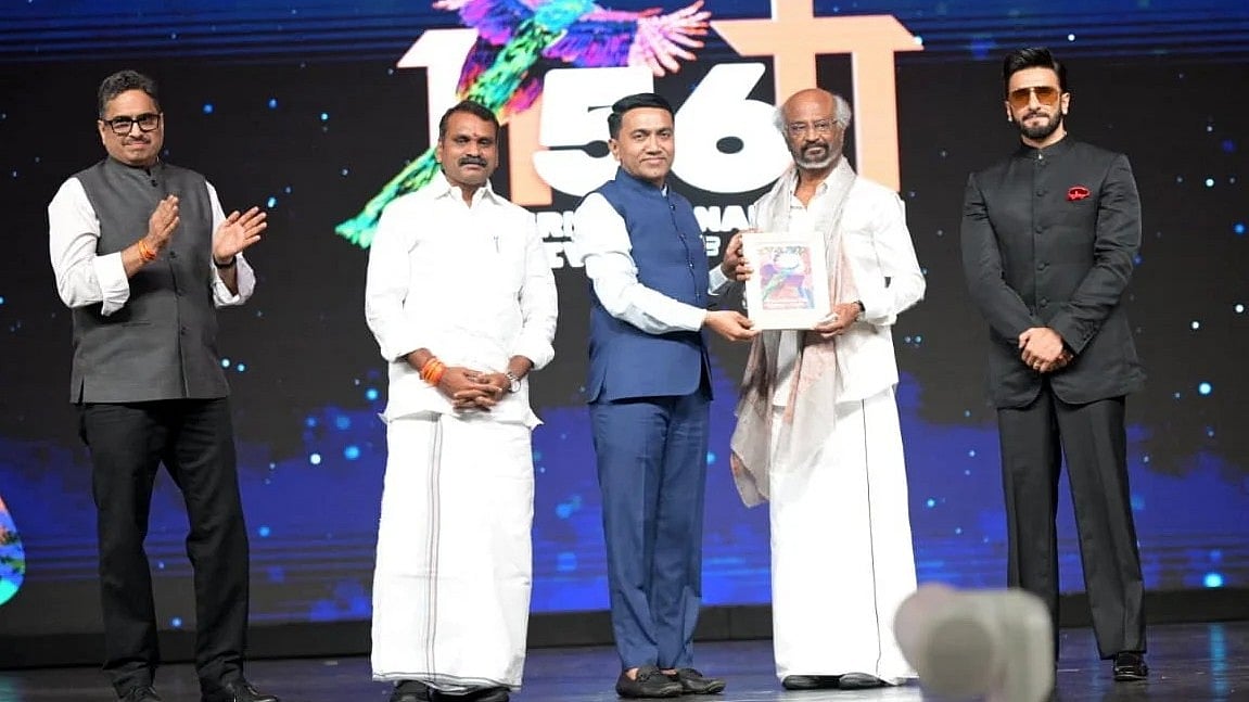 Goa Chief Minister Pramod Sawant confers the lifetime achievement award to superstar Rajinikanth as Union Minister of State L. Murugan and Bollywood actor Ranveer Singh look on during the closing ceremony of the 56th International Film Festival of India (IFFI), in Panaji, Goa, Friday, Nov. 28, 2025. -  PTI Photo