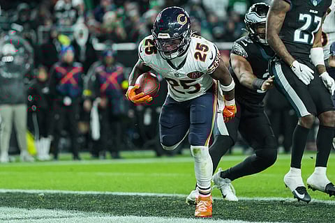 Chicago Bears running back Kyle Monangai (25) scores a touchdown during the second half of an NFL football game against the Philadelphia Eagles in Philadelphia. 