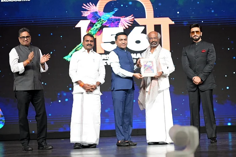 Goa Chief Minister Pramod Sawant confers the lifetime achievement award to superstar Rajinikanth as Union Minister of State L. Murugan and Bollywood actor Ranveer Singh look on during the closing ceremony of the 56th International Film Festival of India (IFFI), in Panaji, Goa, Friday, Nov. 28, 2025. - PTI Photo
