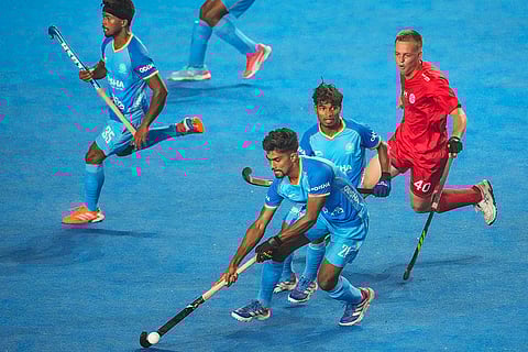 Players of India (in blue) and Chile vie for the ball during the FIH Hockey Men's Junior World Cup 2025 match, at Mayor Radhakrishnan Hockey Stadium, in Chennai, Tamil Nadu.