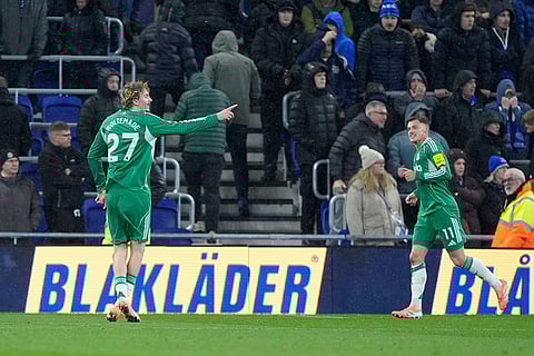 Newcastle United's Nick Woltemade, left, celebrates scoring during the English Premier League soccer match between Everton and Newcastle United in Liverpool, England.