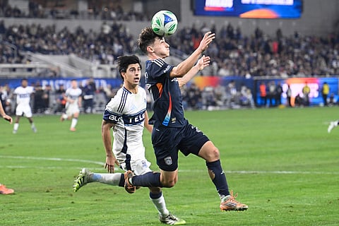 San Diego FC defender Luca Bombino (27) controls the ball in front of Vancouver Whitecaps defender Mathías Laborda (2) during the second half of an MLS Western Conference final soccer match in San Diego. 