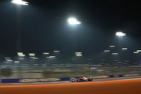 Ferrari driver Lewis Hamilton of Britain steers his car during the second qualifying session at the Lusail International Circuit ahead of the Qatar Formula One Grand Prix, in Lusail, Qatar.