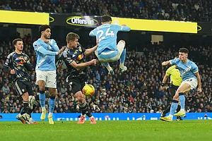 | Photo: AP/Ian Hodgson : Manchester City's Phil Foden, right, scores during the English Premier League soccer match between Manchester City and Leeds United in Manchester, England.
