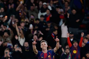 | Photo: AP/Joan Monfort : Barcelona's Dani Olmo celebrates after scoring his side's third goal during a Spanish La Liga soccer match between Barcelona and Alaves, in Barcelona, Spain.