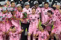 | Photo: AP/Rebecca Blackwell : Inter Miami forward Lionel Messi (10) holds the trophy as Inter Miami players celebrate winning an MLS Eastern Conference final soccer match against New York City FC, in Fort Lauderdale, Florida. 