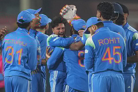 India's Kuldeep Yadav, centre, celebrates the wicket of South Africa's Tony de Zorzi during the first One Day International match between India and South Africa in Ranchi.
