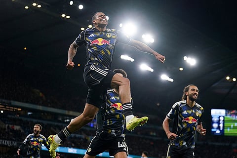 Leeds United's Lukas Nmecha celebrates scoring during the English Premier League soccer match between Manchester City and Leeds United at Etihad Stadium, Manchester, England.