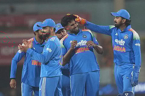 India's Harshit Rana, centre, celebrates the wicket of South Africa's Dewald Brevis during the first One Day International match between India and South Africa in Ranchi.