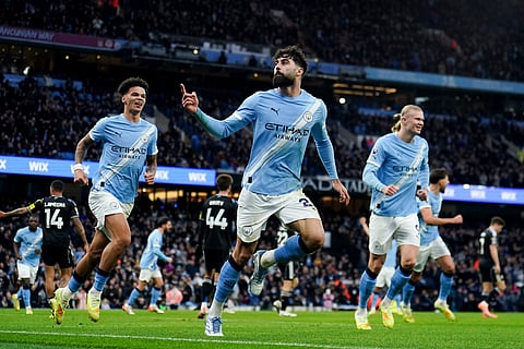 Manchester City's Josko Gvardiol, center, celebrates scoring during the English Premier League soccer match between Manchester City and Leeds United at Etihad Stadium, Manchester, England.