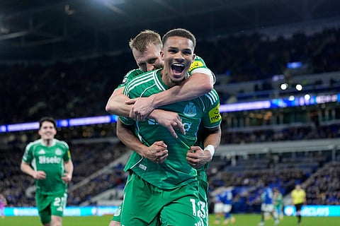 Newcastle United's Malick Thiaw celebrates after scoring his sides fourth goal during the English Premier League soccer match between Everton and Newcastle United in Liverpool, England.