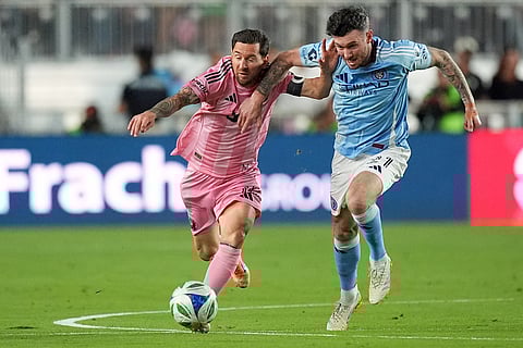Inter Miami forward Lionel Messi, left,clashes with New York City FC midfielder Aiden O'Neill, right, during the first half of an MLS Eastern Conference final soccer match in Fort Lauderdale, Florida. 