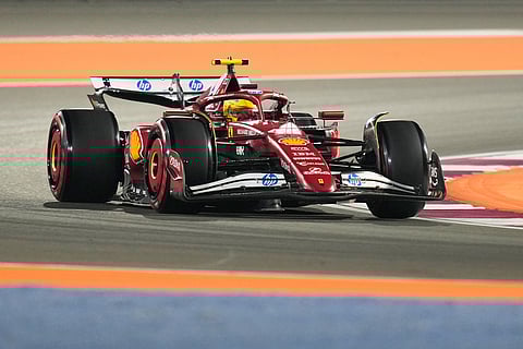 Ferrari driver Lewis Hamilton of Britain steers his car during the qualifying session ahead of the Qatar Formula One Grand Prix, at the Lusail International Circuit, in Lusail, Qatar.
