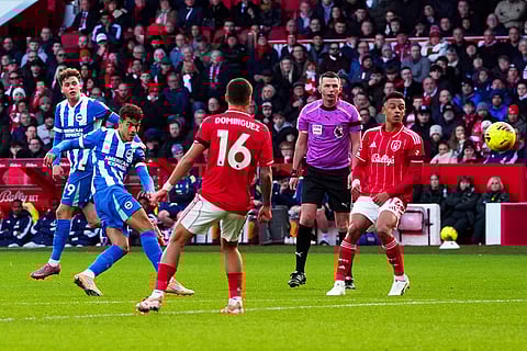 Brighton and Hove Albion's Yasin Ayari has a shot on goal, during the English Premier League soccer match between Nottingham Forest and Bright and Hove Albion,  at the City Ground, in Nottingham, England.